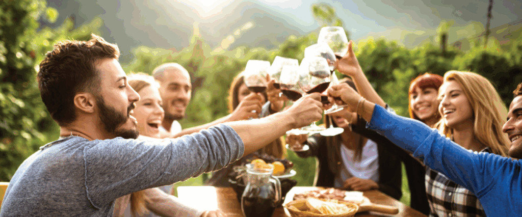 Group of people doing a cheers with wine